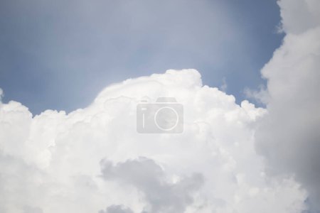 Photo for Large curly clouds of white color on a pale blue sky. Gentle clouds in the blue sky. - Royalty Free Image