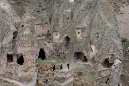 Photo for Cappadocia is famous for its unique mountain cave homes, which were carved into the soft volcanic rock by early Christian communities as a form of shelter and protection. These cave homes are still inhabited today and offer visitors a glimpse into - Royalty Free Image