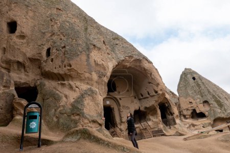 Photo for Cappadocia is famous for its unique mountain cave homes, which were carved into the soft volcanic rock by early Christian communities as a form of shelter and protection. These cave homes are still inhabited today and offer visitors a glimpse into - Royalty Free Image