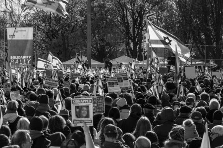 Photo for The UJA (United Jewish Appeal) Solidarity Rally For The Hostages in Toronto on November 12, 2023 transformed the park into a focal point of collective empathy, as participants, against the backdrop of solidarity banners - Royalty Free Image