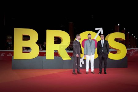 Photo for Rome Italy - October 22, 2022: Luke Macfarlane (L), Billy Eichner (C) and Nicholas Stoller (R) attends in the red carpet of the film "Bros" at the 17th Rome Film Festival at the Auditorium Parco della Musica - Royalty Free Image