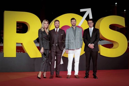 Photo for Rome Italy - October 22, 2022: Luke Macfarlane (2-L), Billy Eichner (C) and Nicholas Stoller (R) attends in the red carpet of the film "Bros" at the 17th Rome Film Festival at the Auditorium Parco della Musica - Royalty Free Image