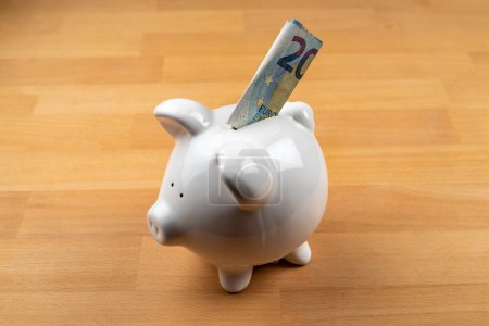 Photo for Piggy bank with 20 Euro note. High quality photo - Royalty Free Image
