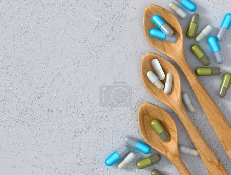 Foto de Conceptos médicos y científicos, cuchara con vitamina, medicina, suplementos dietéticos, cápsulas vista superior, 3d rendering - Imagen libre de derechos