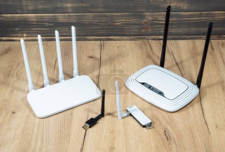 Different types of Wi-Fi routers, modern and old technology. Wireless ethernet connection signal. USB Wifi Receiver Wireless Network Card. High Speed Antenna Wifi Adapters.