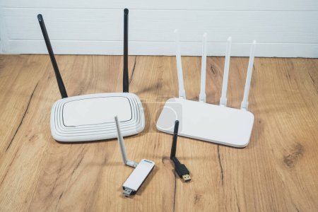 Different types of Wi-Fi routers, modern and old technology. Wireless ethernet connection signal. USB Wifi Receiver Wireless Network Card. High Speed Antenna Wifi Adapters.