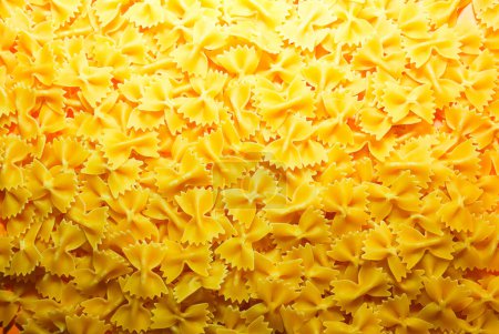 Photo for Pasta from durum wheat. Raw farfalle. Healthy food. Italian dishes. - Royalty Free Image