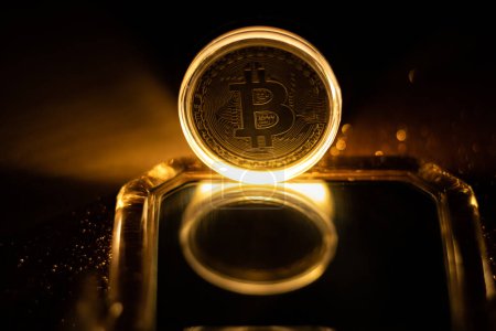 Photo for Golden Bitcoin virtual money concept.Burning bitcoin symbol. Decentralised Cryptocurrency logo of BTC coin. - Royalty Free Image