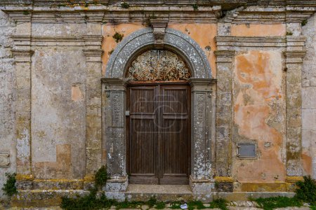 Photo for Very old dilapidated walls with old doors that no one is renovating. - Royalty Free Image