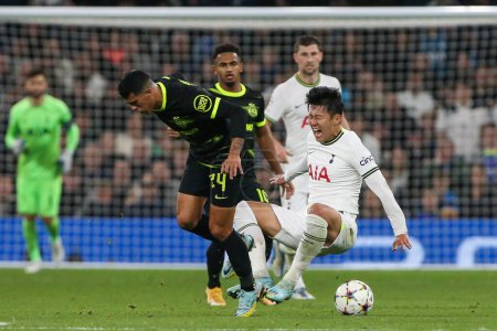 Photo for Son Heung-Min #7 of Tottenham Hotspur is fouled by Pedro Porro #24 of Sporting Lisbon during the UEFA Champions League match Tottenham Hotspur vs Sporting Lisbon at Tottenham Hotspur Stadium, London, United Kingdom, 26th October 202 - Royalty Free Image