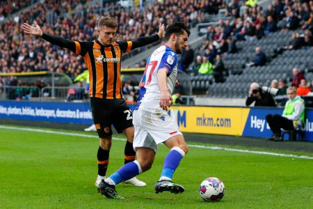 Photo for Regan Slater #27 of Hull City and Lewis Travis #27 of Blackburn Rovers  during the Sky Bet Championship match Hull City vs Blackburn Rovers at MKM Stadium, Hull, United Kingdom, 29th October 202 - Royalty Free Image