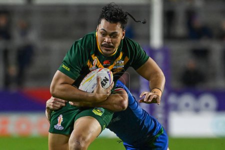 Photo for Jeremiah Nanai of Australia is tackled by Jack Campagnolo of Italy during the Rugby League World Cup 2021 match Australia vs Italy at Totally Wicked Stadium, St Helens, United Kingdom, 29th October 202 - Royalty Free Image