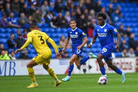 Photo for Sheyi Ojo #10 of Cardiff City  takes om Cohen Bramall #3 of Rotherham United during the Sky Bet Championship match Cardiff City vs Rotherham United at Cardiff City Stadium, Cardiff, United Kingdom, 29th October 202 - Royalty Free Image