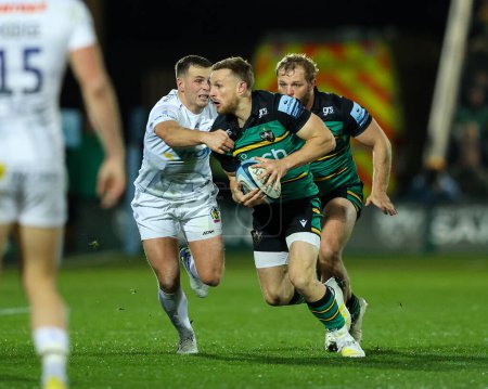 Photo for Fraser Dingwall, captain of Northampton Saints, is grabbed by Joe Simmonds of Exeter Chiefs during the Gallagher Premiership match Northampton Saints vs Exeter Chiefs at the cinch Stadium at Franklin's Gardens, Northampton, United Kingdom, 4th Novemb - Royalty Free Image