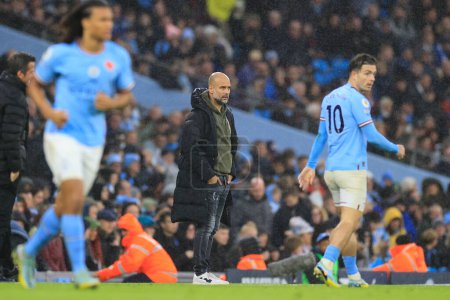 Photo for Pep Guardiola the Manchester City manager during the end of the Premier League match Manchester City vs Fulham at Etihad Stadium, Manchester, United Kingdom, 5th November 202 - Royalty Free Image