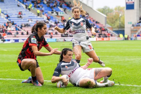 Photo for Carrie Roberts of England goes over for a try during the Women's Rugby League World Cup match England Women vs Canada Women at DW Stadium, Wigan, United Kingdom, 5th November 202 - Royalty Free Image