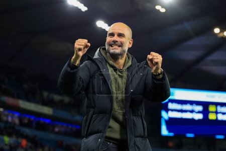 Photo for Pep Guardiola the Manchester City manager     celebrates the 2-1 victory in the Premier League match Manchester City vs Fulham at Etihad Stadium, Manchester, United Kingdom, 5th November 202 - Royalty Free Image