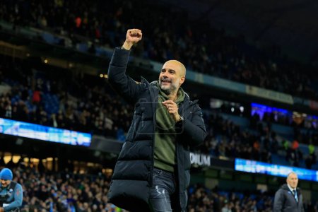 Photo for Pep Guardiola the Manchester City manager     celebrates the 2-1 victory in the Premier League match Manchester City vs Fulham at Etihad Stadium, Manchester, United Kingdom, 5th November 202 - Royalty Free Image