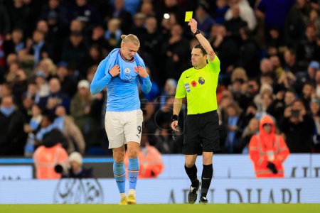 Photo for Erling Haaland #9 of Manchester City  is booked for taking his shirt off during the goal celebration in the Premier League match Manchester City vs Fulham at Etihad Stadium, Manchester, United Kingdom, 5th November 202 - Royalty Free Image