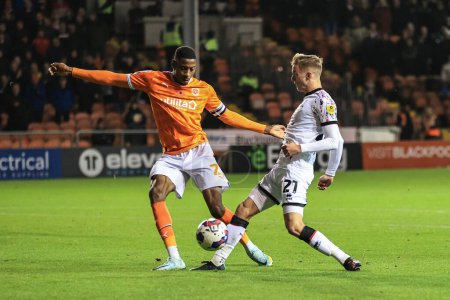 Photo for Marvin Ekpiteta #21 of Blackpool and Marcus Forss #21 of Middlesbrough battle for the ball during the Sky Bet Championship match Blackpool vs Middlesbrough at Bloomfield Road, Blackpool, United Kingdom, 8th November 202 - Royalty Free Image