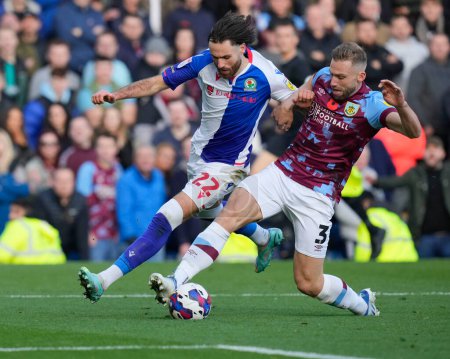 Photo for Charlie Taylor #3 of Burnley competes for the ball with  Ben Brereton Daz #22 of Blackburn Rovers during the Sky Bet Championship match Burnley vs Blackburn Rovers at Turf Moor, Burnley, United Kingdom, 13th November 2022 - Royalty Free Image