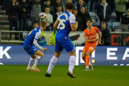 Photo for Charlie Patino #28 of Blackpool passes up field during the Sky Bet Championship match Wigan Athletic vs Blackpool at DW Stadium, Wigan, United Kingdom, 12th November 202 - Royalty Free Image