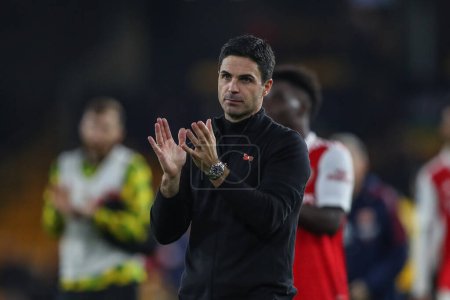 Photo for Mikel Arteta manager of Arsenal applauds the travelling fans after the Premier League match Wolverhampton Wanderers vs Arsenal at Molineux, Wolverhampton, United Kingdom, 12th November 202 - Royalty Free Image