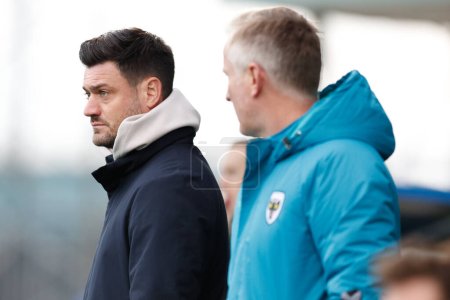Photo for Johnnie Jackson manager of AFC Wimbledon watches on during the Sky Bet League 2 match Tranmere Rovers vs AFC Wimbledon at Prenton Park, Birkenhead, United Kingdom, 19th November 2022 - Royalty Free Image