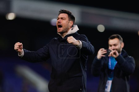 Photo for Johnnie Jackson manager of AFC Wimbledon celebrates after the Sky Bet League 2 match Tranmere Rovers vs AFC Wimbledon at Prenton Park, Birkenhead, United Kingdom, 19th November 2022 - Royalty Free Image