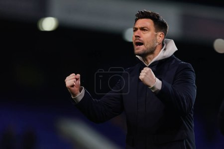 Photo for Johnnie Jackson manager of AFC Wimbledon celebrates after the Sky Bet League 2 match Tranmere Rovers vs AFC Wimbledon at Prenton Park, Birkenhead, United Kingdom, 19th November 2022 - Royalty Free Image