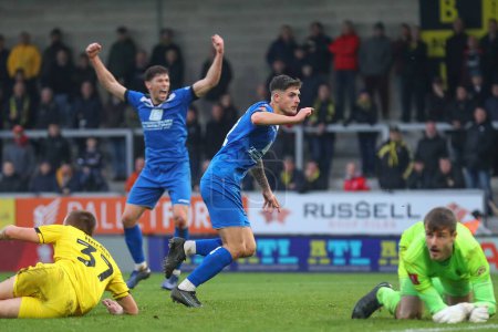 Photo for Harry Parsons #12 of Chippenham Town celebrates his goal to make it 3-1 during the Emirates FA Cup Round 2 match Burton Albion vs Chippenham Town at Pirelli Stadium, Burton upon Trent, United Kingdom, 27th November 2022 - Royalty Free Image