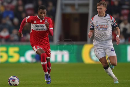 Photo for Isaiah Jones #2 of Middlesbrough runs away from Alfie Doughty #45 of Luton Town during the Sky Bet Championship match Middlesbrough vs Luton Town at Riverside Stadium, Middlesbrough, United Kingdom, 10th December 2022 - Royalty Free Image