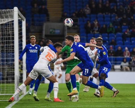 Photo for Rhys Williams #15 of Blackpool  and Mahlon Romeo #2 of Cardiff City  tussle for the ball during the Sky Bet Championship match Cardiff City vs Blackpool at Cardiff City Stadium, Cardiff, United Kingdom, 17th December 2022 - Royalty Free Image