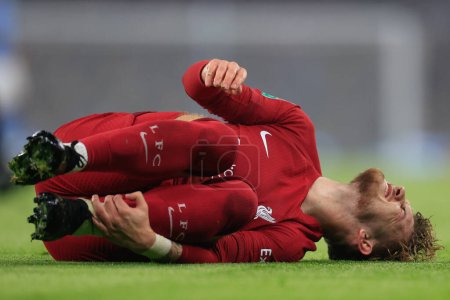Photo for Harvey Elliott #19 of Liverpool goes down injured during the Carabao Cup Fourth Round match Manchester City vs Liverpool at Etihad Stadium, Manchester, United Kingdom, 22nd December 202 - Royalty Free Image