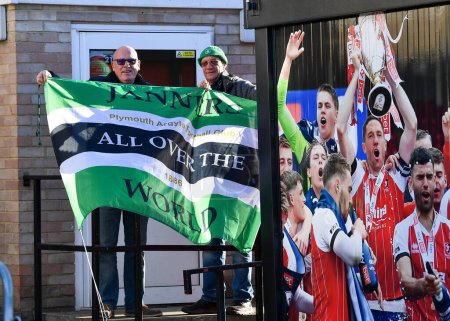 Photo for Plymouth Argyle fans with Janners flag arrives  during the Sky Bet League 1 match Cheltenham Town vs Plymouth Argyle at The Jonny-Rocks Stadium, Cheltenham, United Kingdom, 26th December 202 - Royalty Free Image