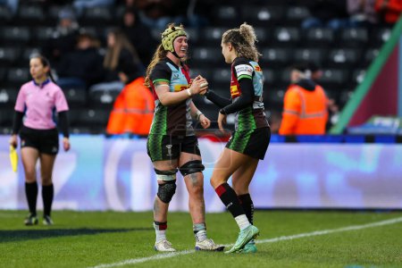 Photo for Ellie Kildunne of Harlequins Women is congratulated by Emily Robinson of Harlequins Women after scoring a try during the Women's Allianz Premier 15's match Harlequins Women vs Bristol Bears Women at Twickenham Stoop , London, United Kingdom, 27th Dec - Royalty Free Image