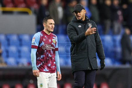 Photo for Vincent Kompany manager of Burnley speaks to Connor Roberts #14 at the end of the Sky Bet Championship match Burnley vs Birmingham City at Turf Moor, Burnley, United Kingdom, 27th December 202 - Royalty Free Image