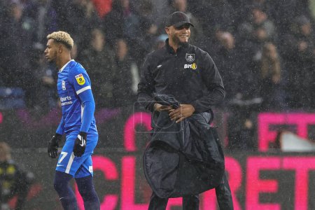 Photo for Vincent Kompany manager of Burnley walks over to the dugout through the rain ahead of  the Sky Bet Championship match Burnley vs Birmingham City at Turf Moor, Burnley, United Kingdom, 27th December 202 - Royalty Free Image