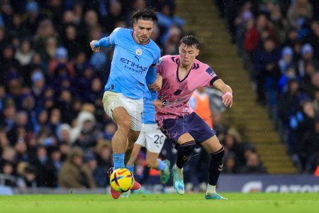 Foto de Jack Grealish #10 of Manchester City  and Nathan Patterson #3 of Everton challenge for the ball during the game the Premier League match Manchester City vs Everton at Etihad Stadium, Manchester, United Kingdom, 31st December 202 - Imagen libre de derechos