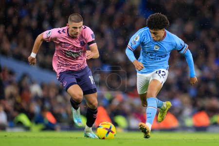 Photo for Rico Lewis #82 of Manchester City runs past Vitaly Mykolenko #19 of Everton during the Premier League match Manchester City vs Everton at Etihad Stadium, Manchester, United Kingdom, 31st December 202 - Royalty Free Image