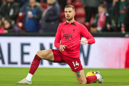 Foto de Jordan Henderson #14 of Liverpool stretches during the pre-game warmup ahead of the Premier League match Liverpool vs Leicester City at Anfield, Liverpool, United Kingdom, 30th December 202 - Imagen libre de derechos