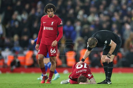 Photo for Referee checks on Harvey Elliott #19 of Liverpool on the floor during the Premier League match Liverpool vs Leicester City at Anfield, Liverpool, United Kingdom, 30th December 202 - Royalty Free Image