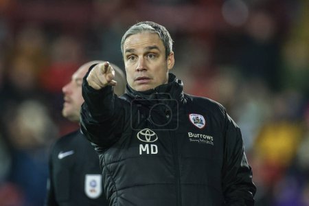 Photo for Michael Duff manager of Barnsley looks on during the Sky Bet League 1 match Barnsley vs Bolton Wanderers at Oakwell, Barnsley, United Kingdom, 2nd January 202 - Royalty Free Image