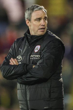 Photo for Michael Duff manager of Barnsley looks on during the Sky Bet League 1 match Barnsley vs Bolton Wanderers at Oakwell, Barnsley, United Kingdom, 2nd January 202 - Royalty Free Image