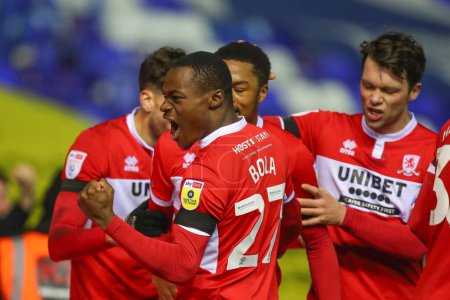 Photo for Marc Bola #27 of Middlesbrough celebrates Chuba Akpom #29 of Middlesbrough goal to make it 1-3 during the Sky Bet Championship match Birmingham City vs Middlesbrough at St Andrews, Birmingham, United Kingdom, 2nd January 202 - Royalty Free Image
