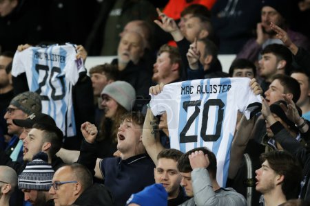 Photo for Brighton & Hove Albion fans hold up Alexis Mac Allister of Brighton & Hove Albions Argentina Shirt during the Premier League match Everton vs Brighton and Hove Albion at Goodison Park, Liverpool, United Kingdom, 3rd January 2022 - Royalty Free Image