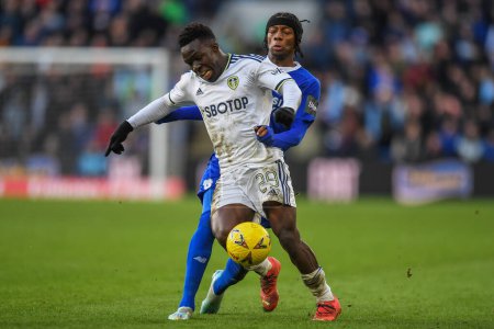 Photo for Wilfried Gnonto #29 of Leeds United under pressure from Jaden Philogene-Bidace #25 of Cardiff City  during the Emirates FA Cup Third Round match Cardiff City vs Leeds United at Cardiff City Stadium, Cardiff, United Kingdom, 8th January 202 - Royalty Free Image