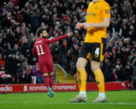 Téléchargez les photos : Mohamed Salah #11 of Liverpool celebrates scoring to make it 2-1 during the Emirates FA Cup Third Round match Liverpool vs Wolverhampton Wanderers at Anfield, Liverpool, United Kingdom, 7th January 202 - en image libre de droit