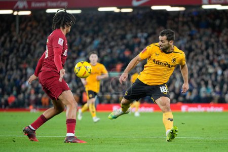 Téléchargez les photos : Trent Alexander-Arnold #66 of Liverpool blocks the ball under pressure from Jonny #19 of Wolverhampton Wanderers during the Emirates FA Cup Third Round match Liverpool vs Wolverhampton Wanderers at Anfield, Liverpool, United Kingdom, 7th January 202 - en image libre de droit