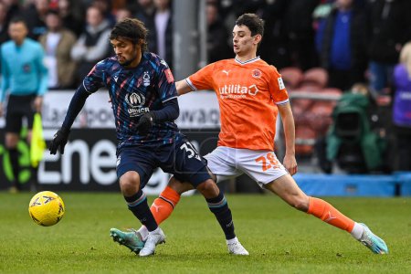 Foto de Charlie Patino #28 of Blackpool is tackled by Gustavo Scarpa #31 of Nottingham Forest during the Emirates FA Cup Third Round match Blackpool vs Nottingham Forest at Bloomfield Road, Blackpool, United Kingdom, 7th January 202 - Imagen libre de derechos